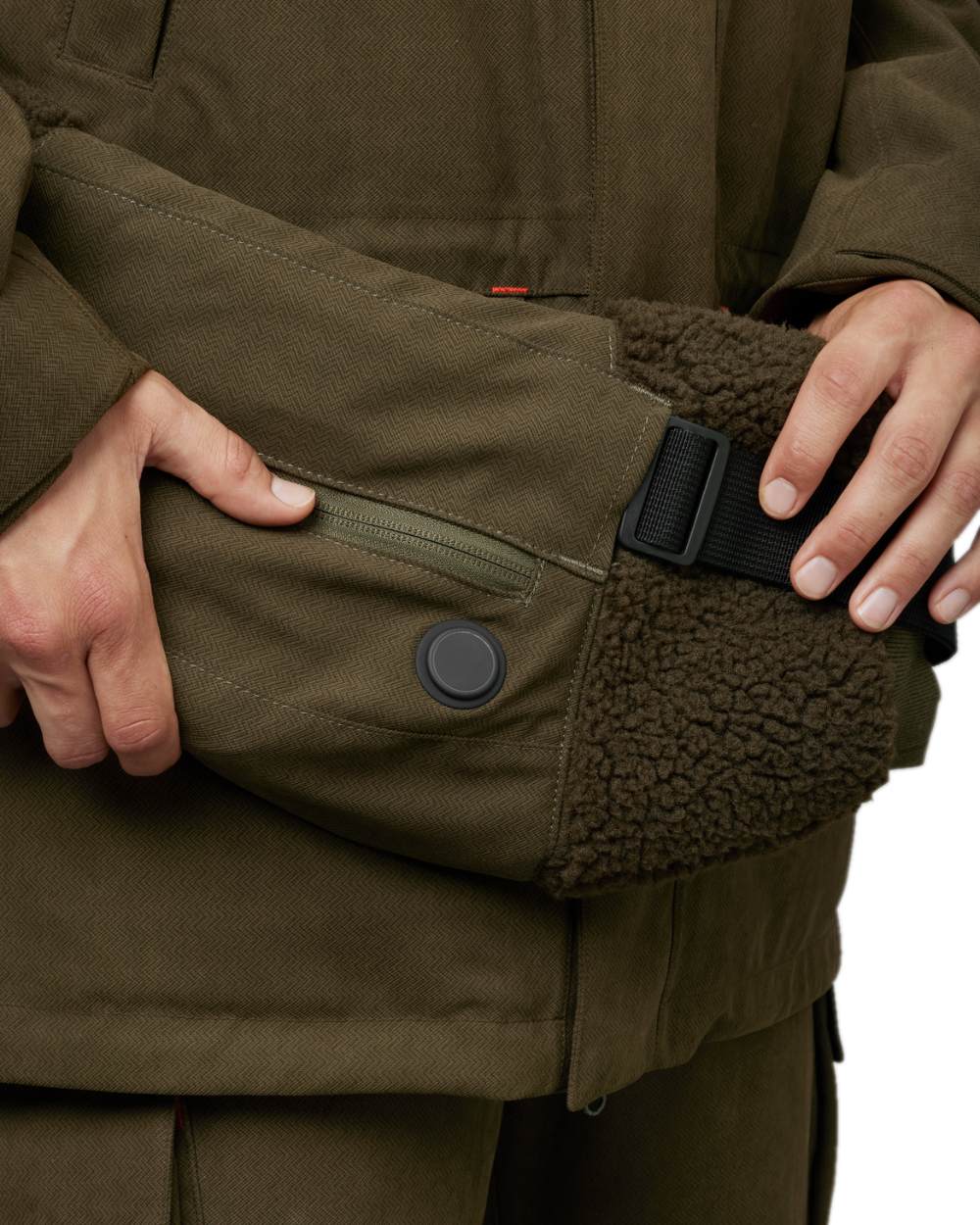 Willow Green Coloured Harkila Driven Hunt Heat Muff on white background #colour_willow-green