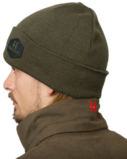 Willow Green Coloured Harkila Driven Hunt Reversible Beanie on white background #colour_willow-green