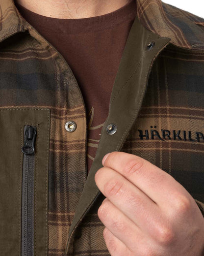 Dark Warm Olive Burgundy Coloured Harkila Eirik Reversible Shirt Jacket on white background #colour_dark-warm-olive-burgundy