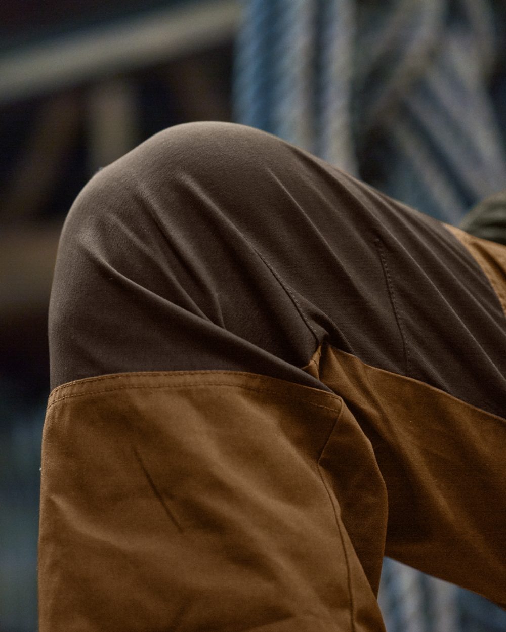 Rustique Clay Brown Coloured Harkila Fjell Trousers on factory background #colour_rustique-clay-brown