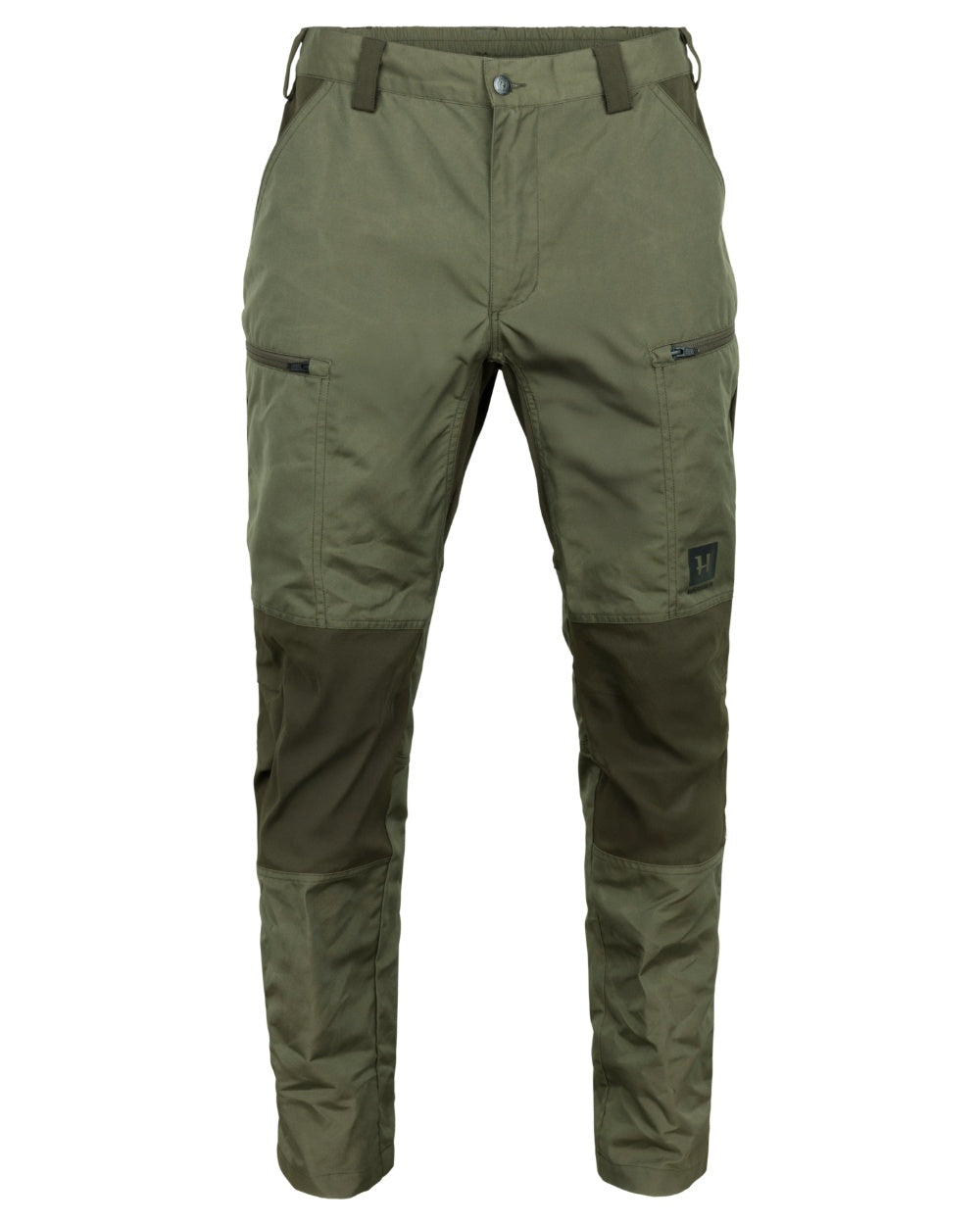 Grape Leaf Willow Green Coloured Harkila Fjell Trousers on factory background #colour_grape-leaf-willow-green
