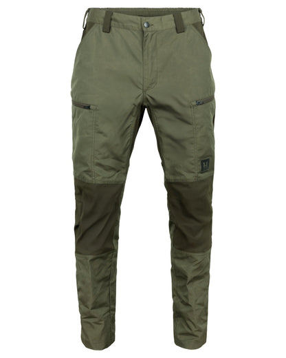 Grape Leaf Willow Green Coloured Harkila Fjell Trousers on factory background #colour_grape-leaf-willow-green