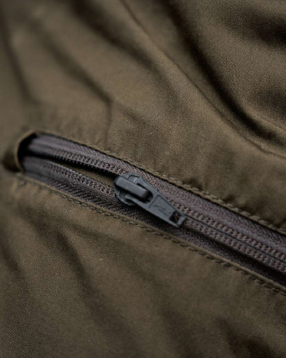 Willow Green Shadow Brown Coloured Harkila Fjell Trousers on blurry background #colour_willow-green-shadow-brown
