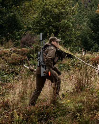 Hunting Green Shadow Brown Coloured Harkila Forest Hunter GTX Jacket on outdoor background #colour_hunting-green-shadow-brown