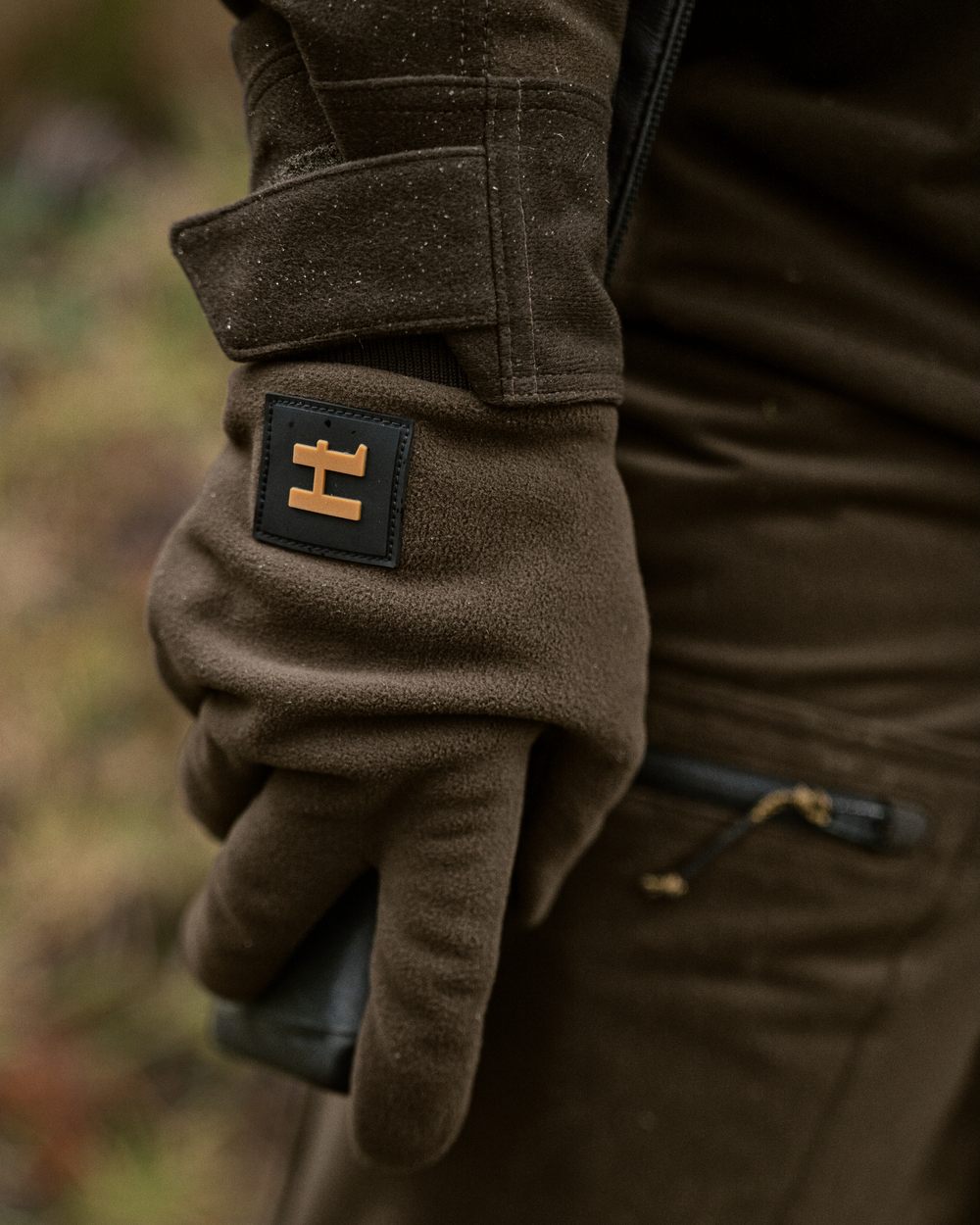 Hunting Green Shadow Brown Coloured Harkila Forest Hunter WSP Gloves on outdoor background #colour_hunting-green-shadow-brown