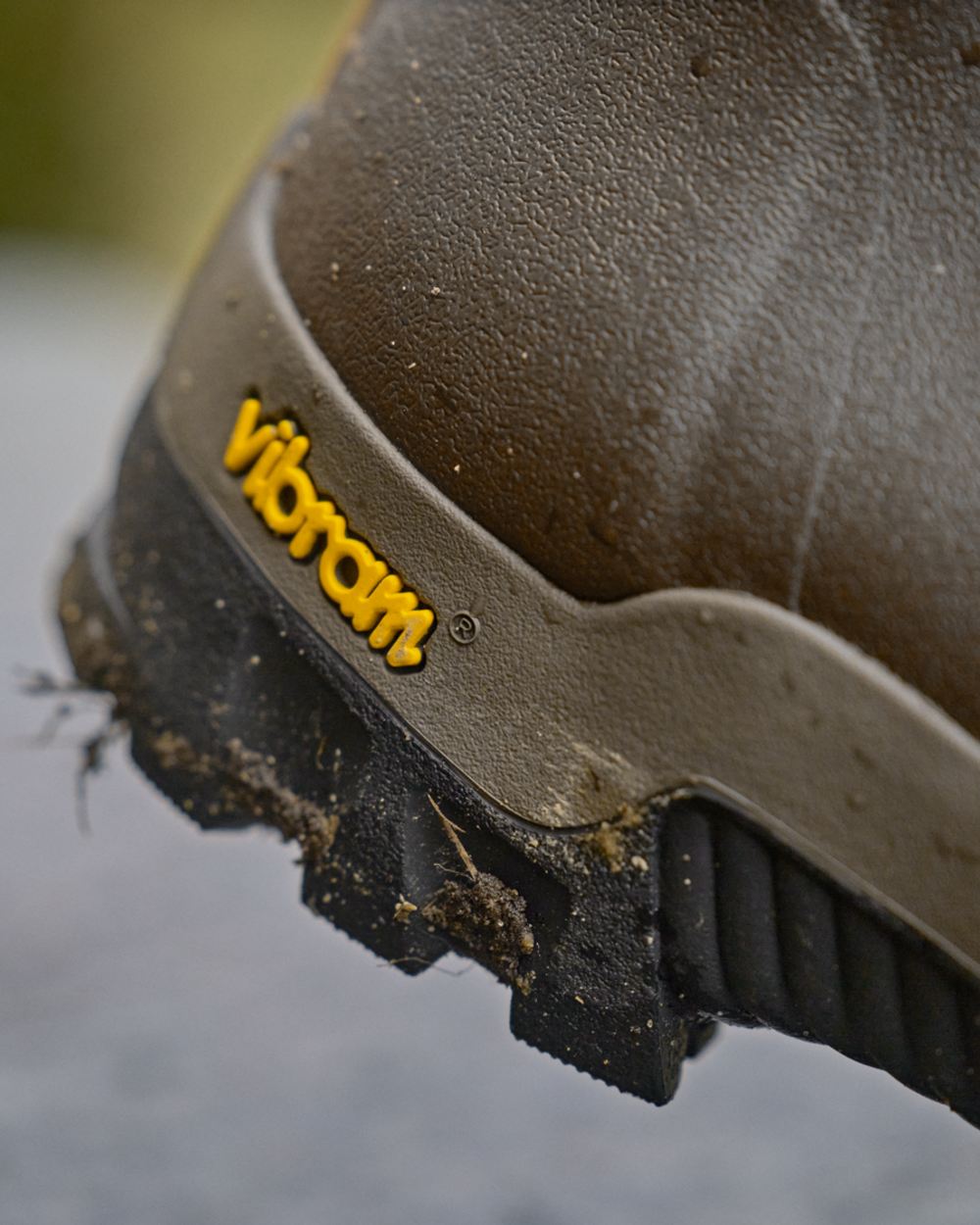 Dark Willow Green Coloured Harkila Forester Gusset Rubber Boots on outdoor background #colour_dark-willow-green