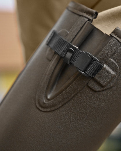 Dark Willow Green Coloured Harkila Forester Gusset Rubber Boots on outdoor background #colour_dark-willow-green