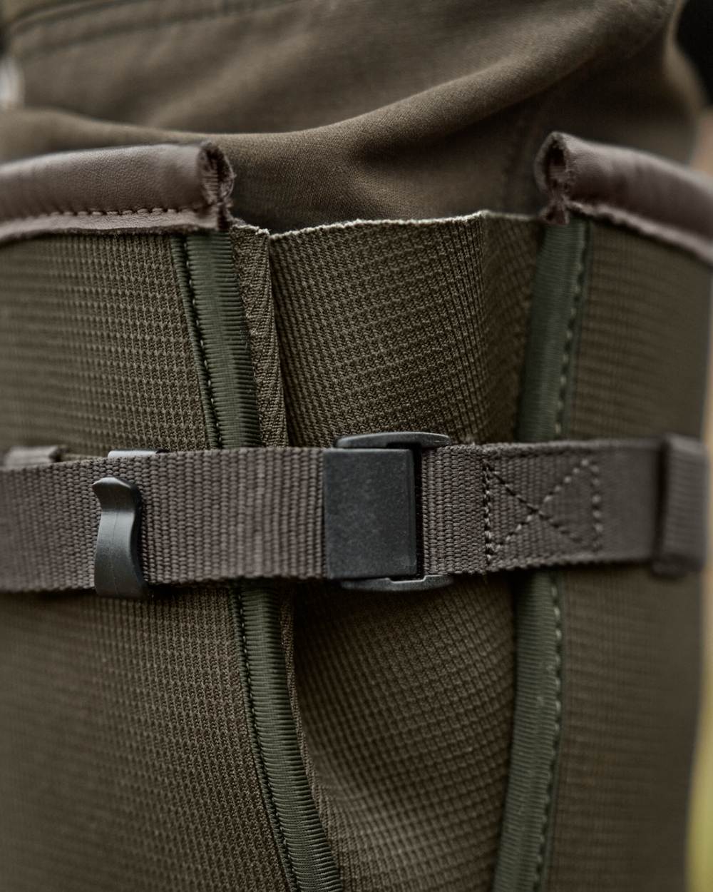 Willow Green Deep Brown Coloured Harkila Forester Zip Rubber Boot on outdoor background #colour_willow-green-deep-brown