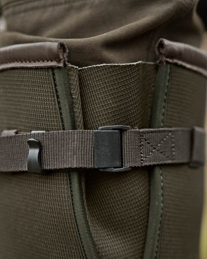 Willow Green Deep Brown Coloured Harkila Forester Zip Rubber Boot on outdoor background #colour_willow-green-deep-brown