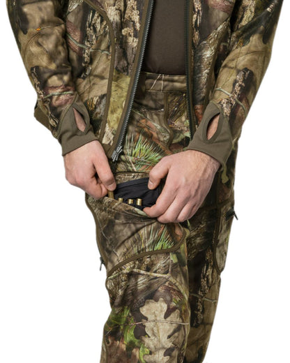 Hunting Green MossyOak Coloured Harkila Kamko Camo Reversible WSP Trousers on white background #colour_hunting-green-mossyoak