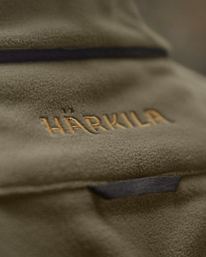 Dark Antique Bronze Willow Green Coloured Harkila Kamko Fleece on outdoor background #colour_dark-antique-bronze-willow-green