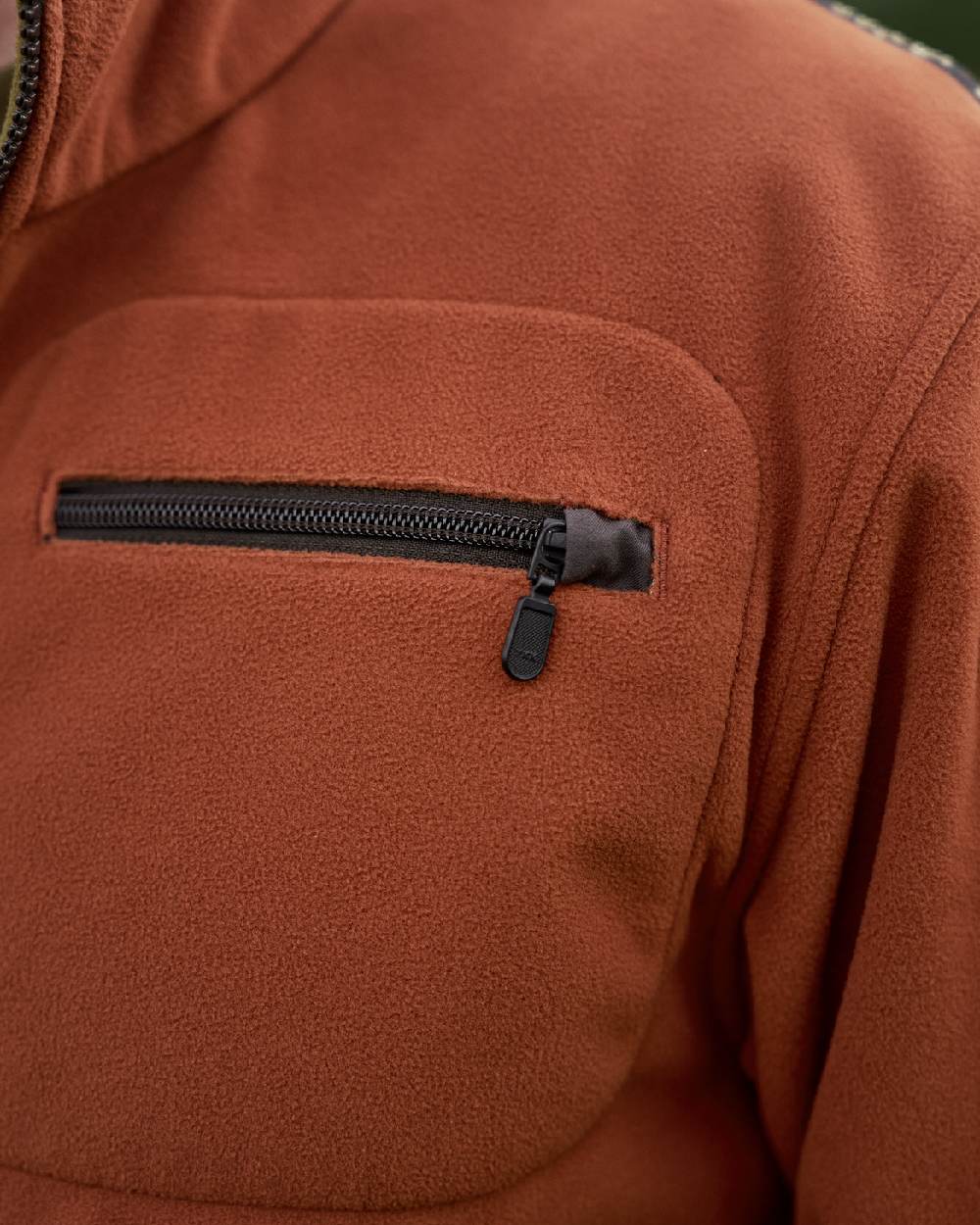 Dark Olive Arabian Spice Coloured Harkila Kamko Fleece on outdoor background #colour_dark-olive-arabian-spice