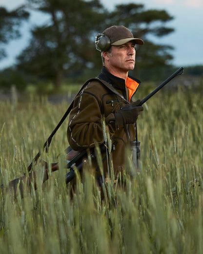 Hunting Green Orange Blaze Coloured Harkila Kamko Fleece on outdoor background #colour_hunting-green-orange-blaze
