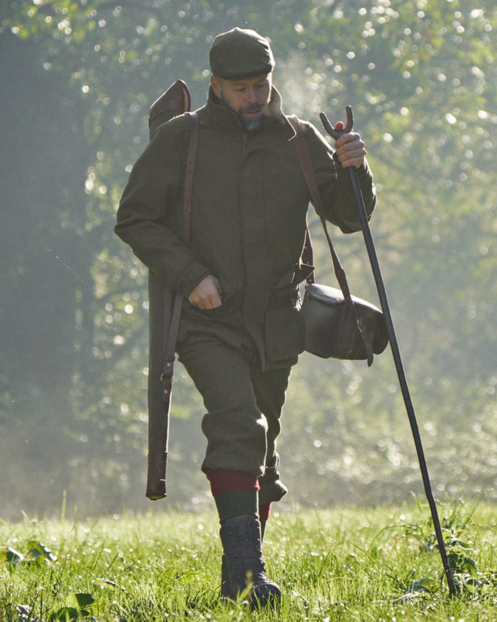 Forest Green Herringbone Coloured Harkila Kenmore GTX Breeks on forest background #colour_forest-green-herringbone