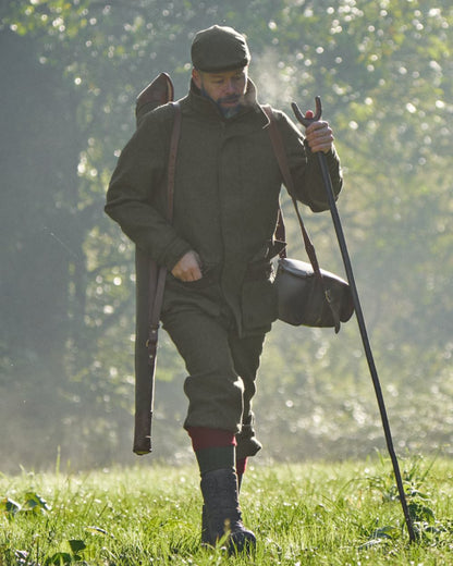 Forest Green Herringbone Coloured Harkila Kenmore GTX Breeks on forest background #colour_forest-green-herringbone