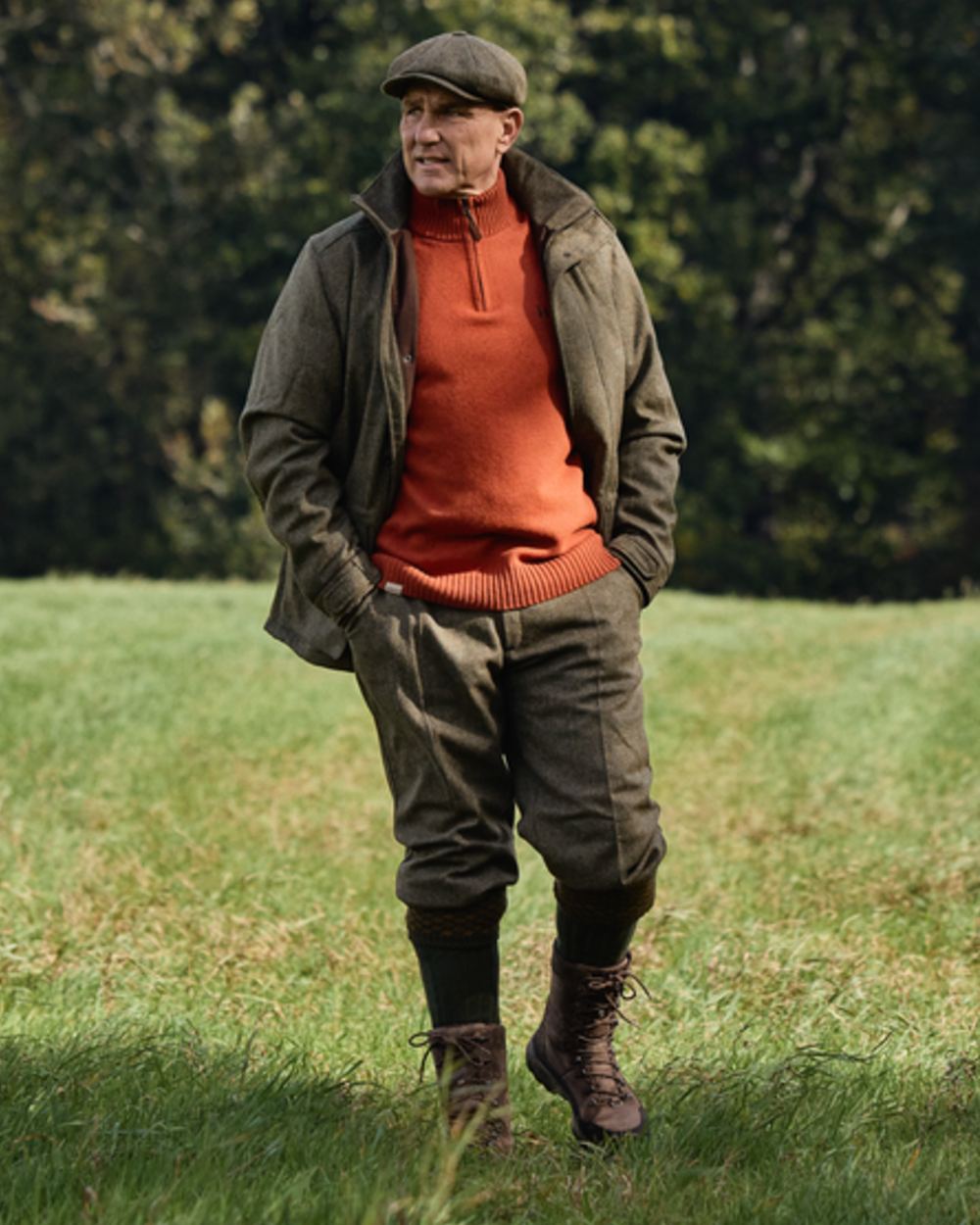 Forest Green Herringbone coloured Harkila Kenmore GTX Breeks on forest background #colour_forest-green-herringbone