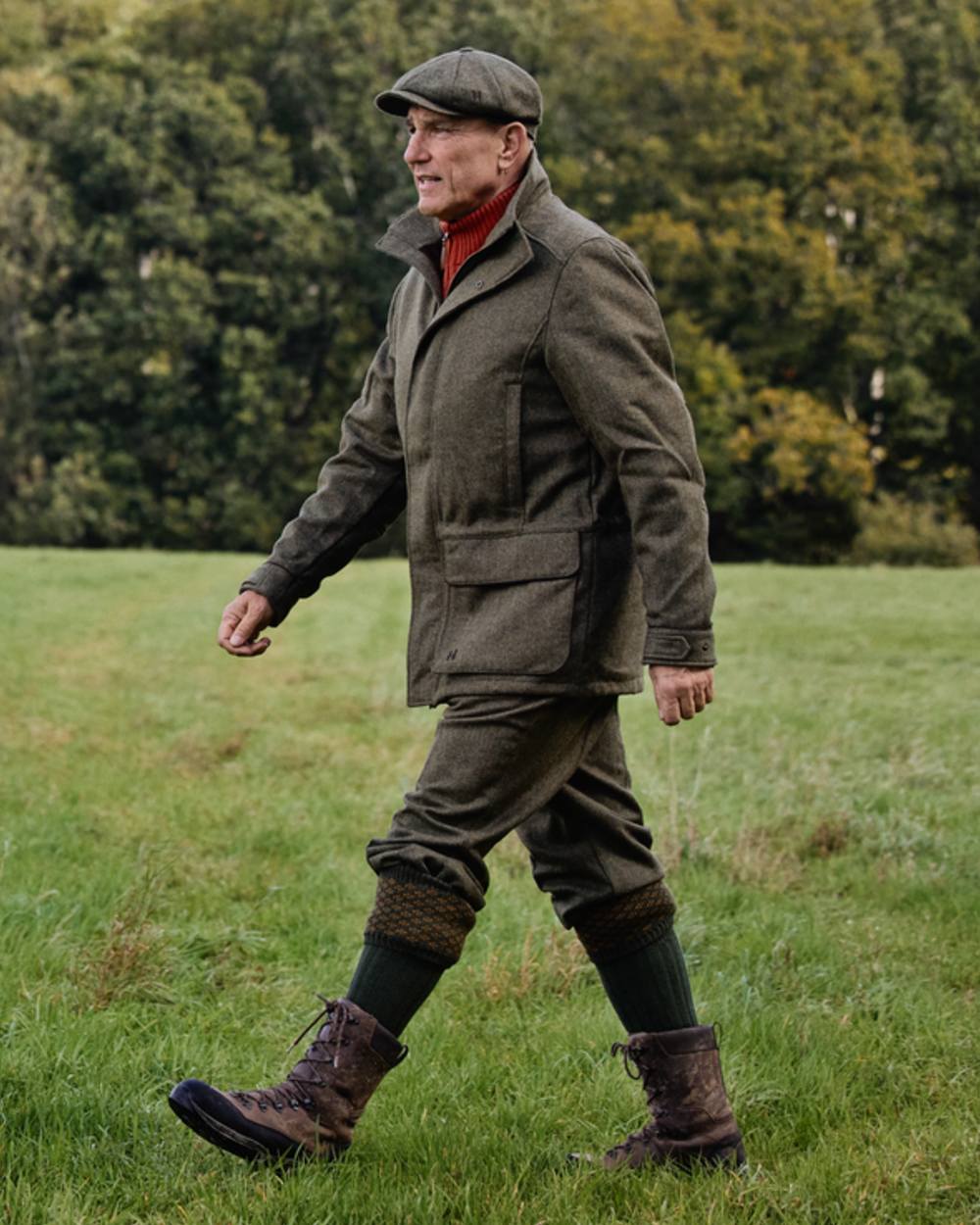 Forest Green Herringbone coloured Harkila Kenmore GTX Breeks on forest background #colour_forest-green-herringbone