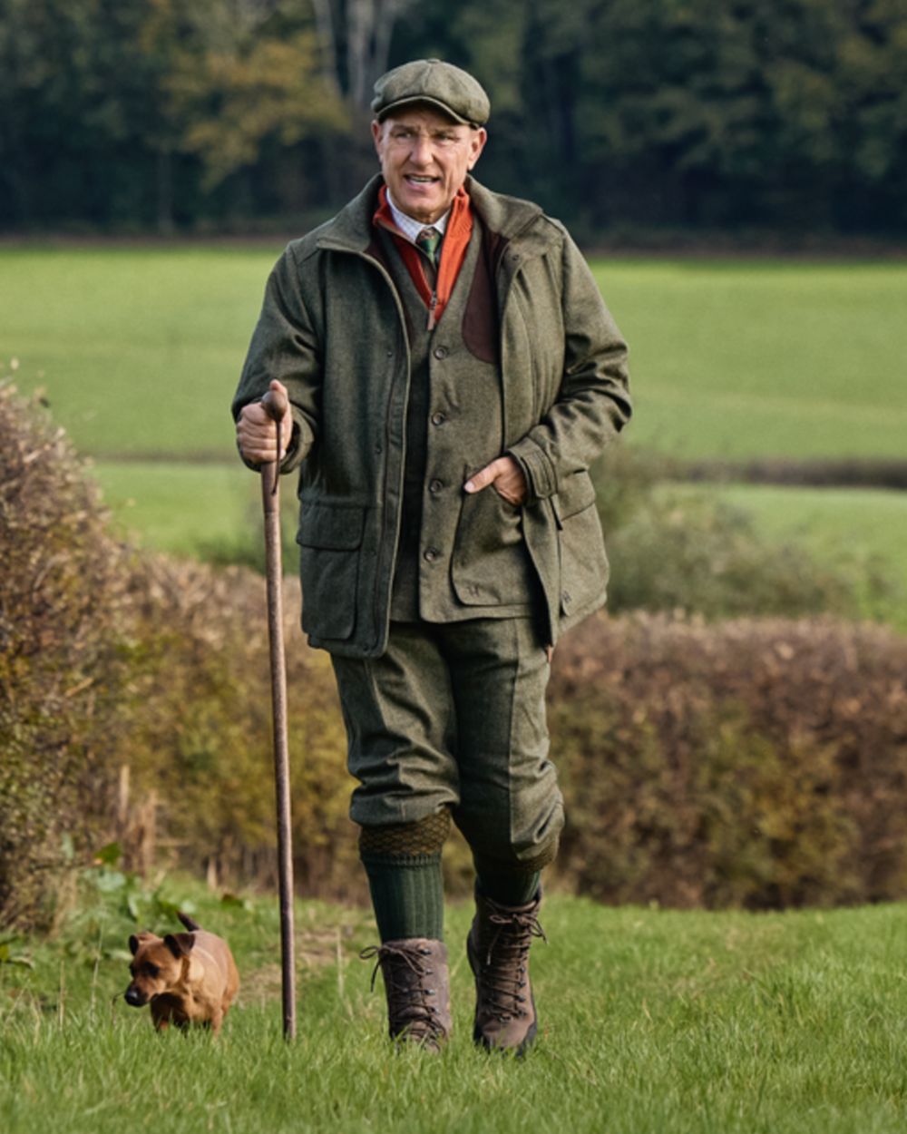Forest Green Herringbone Coloured Harkila Kenmore GTX Jacket on forest background #colour_forest-green-herringbone
