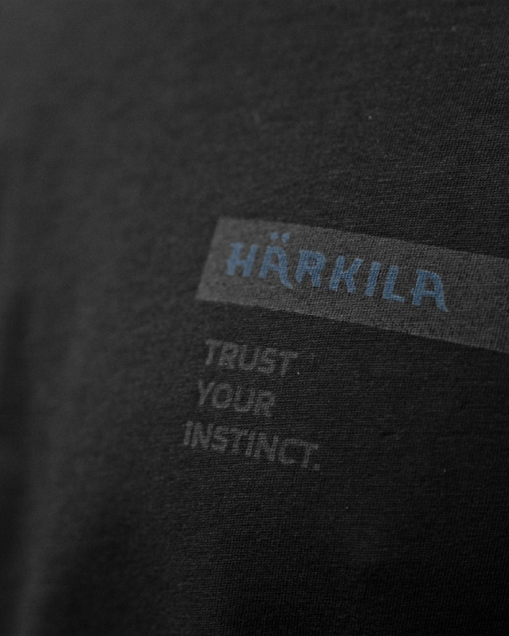 Shadow Brown/Tarmac coloured Harkila Logo Band Short Sleeve T-Shirt on outdoor background #colour_shadow-brown-tarmac