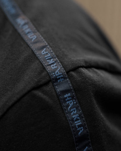 Shadow Brown/Tarmac coloured Harkila Logo Band Short Sleeve T-Shirt on outdoor background #colour_shadow-brown-tarmac
