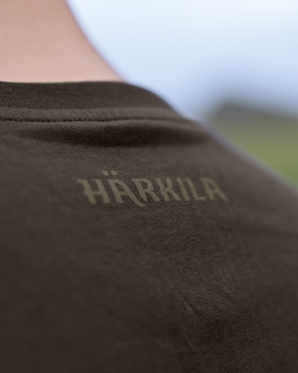 Anthractite/Sea Blue coloured Harkila Logo Band Short Sleeve T-Shirt on outdoor background #colour_anthracite-sea-blue