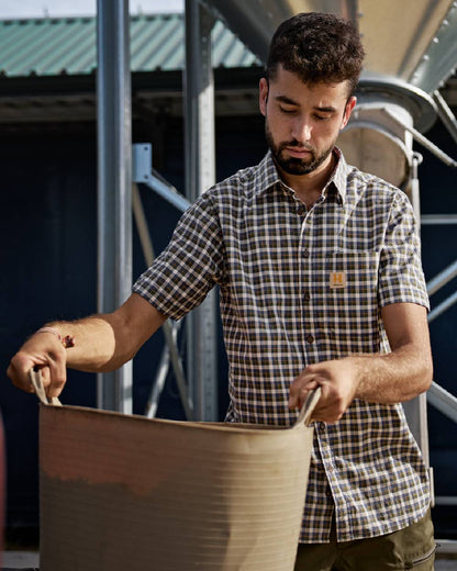 Naval Blue Check Coloured Harkila Mens Fjell Short Sleeve Shirt on construction background #colour_naval-blue-check