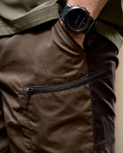 Dark Earth Shadow Brown Coloured Harkila Mens Fjell Shorts on studio background #colour_dark-earth-shadow-brown