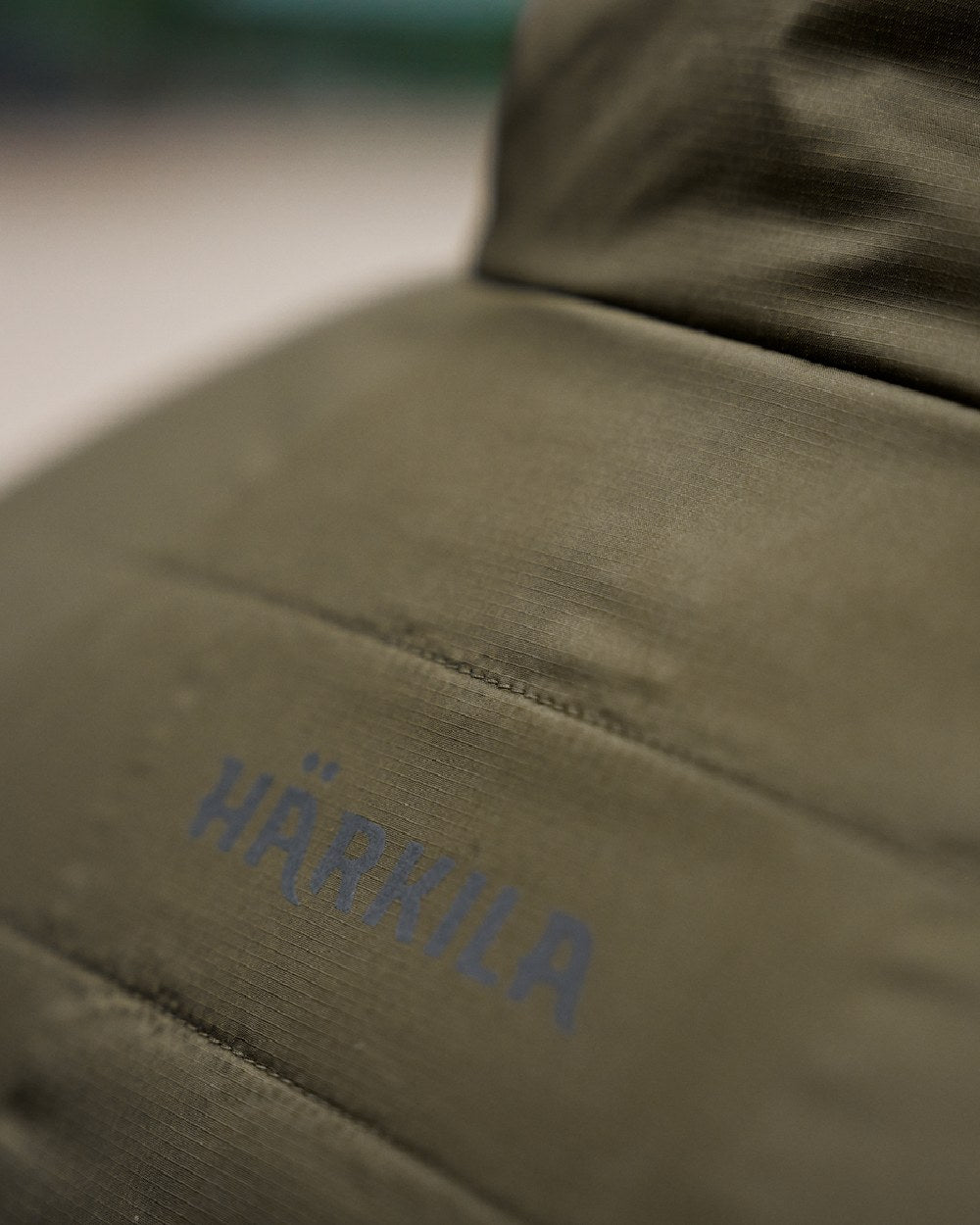 Willow Green Sea Blue Coloured Harkila Mens Kalix HSP Jacket on blurry background #colour_willow-green-sea-blue