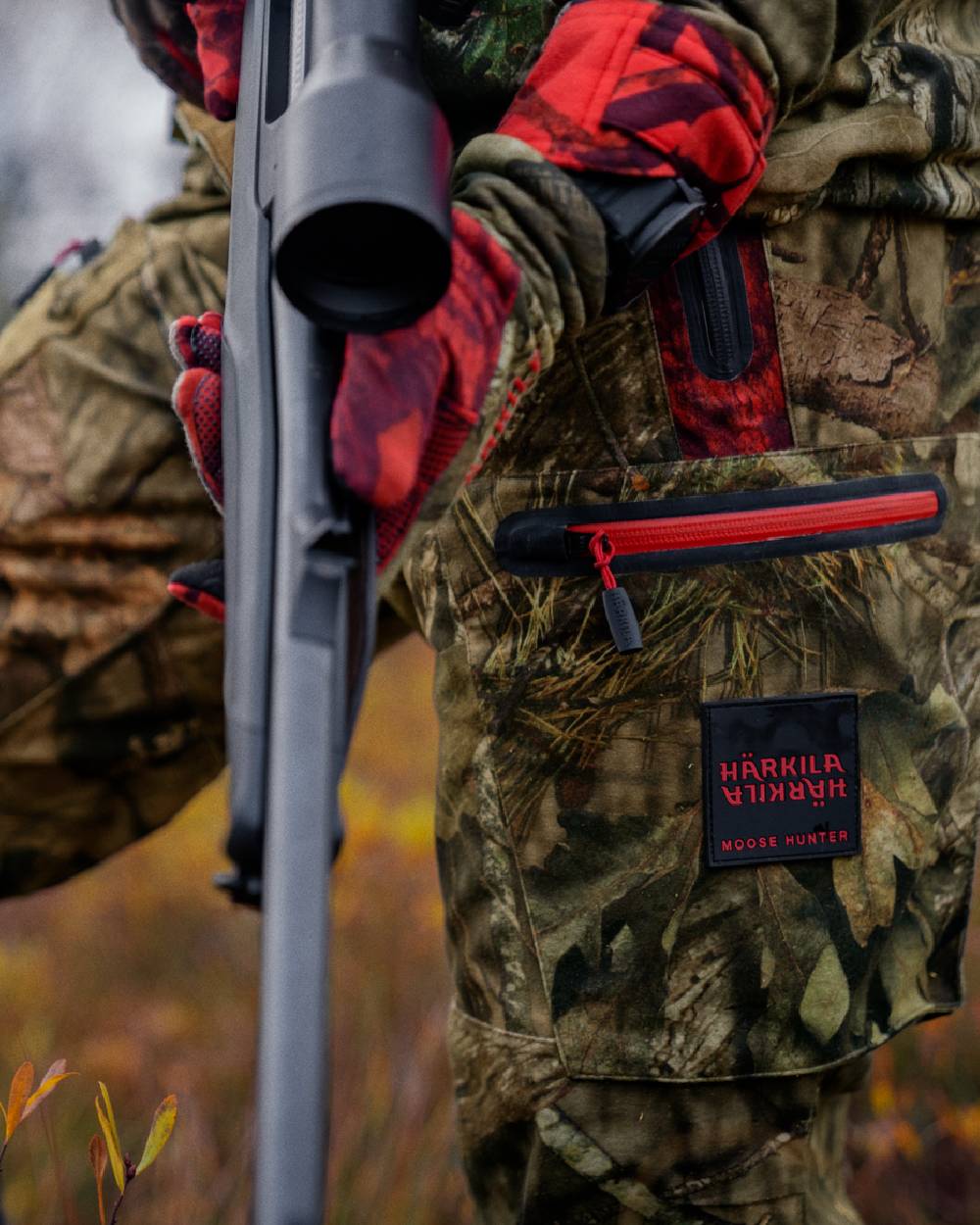 MossyOak Break-Up Country MossyOak Red Coloured Harkila Moose Hunter 2.0 GTX Trousers on outdoor background #colour_mossyoak-break-up-country-mossyoak-red