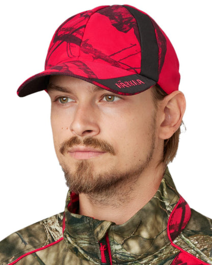 Mossy Oak Red Coloured Harkila Moose Hunter 2.0 Safety Cap on white background #colour_mossy-oak-red