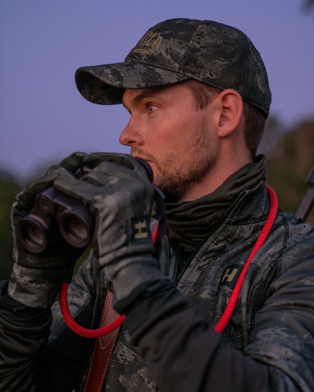 AXIS Black Black Coloured Harkila NOCTYX Camo Light Cap on outdoor background #colour_axis-black-black