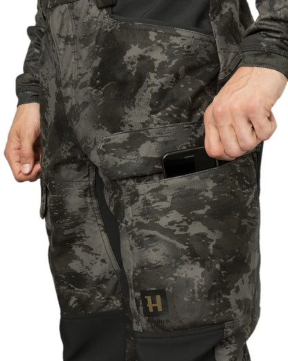 AXIS Black Black Coloured Harkila NOCTYX Camo Silent Trousers on white background #colour_axis-black-black