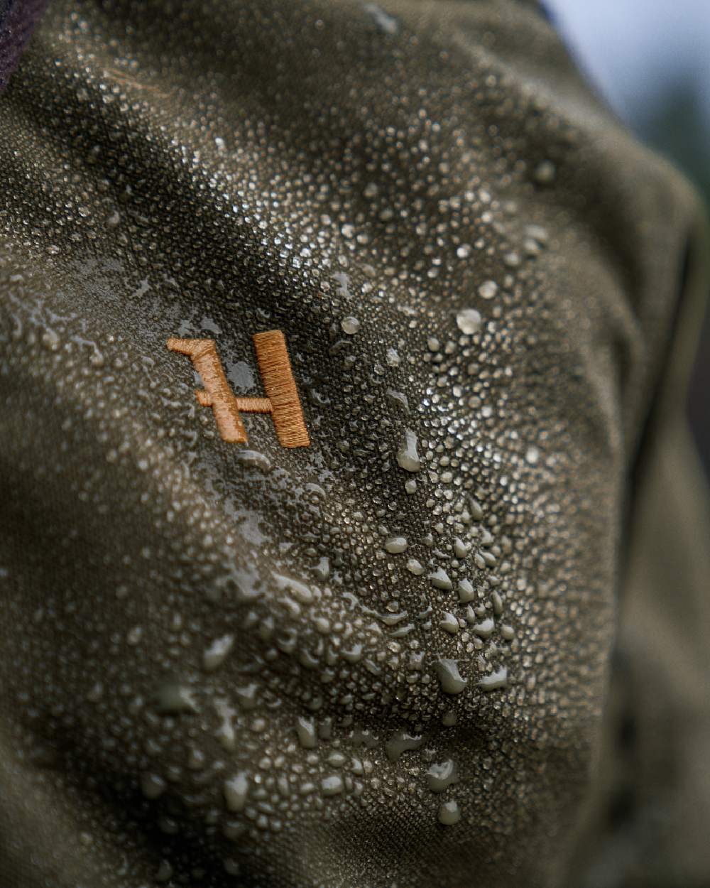 Willow Green Coloured Harkila Pro Hunter Move 2.0 GTX Jacket on outdoor background #colour_willow-green