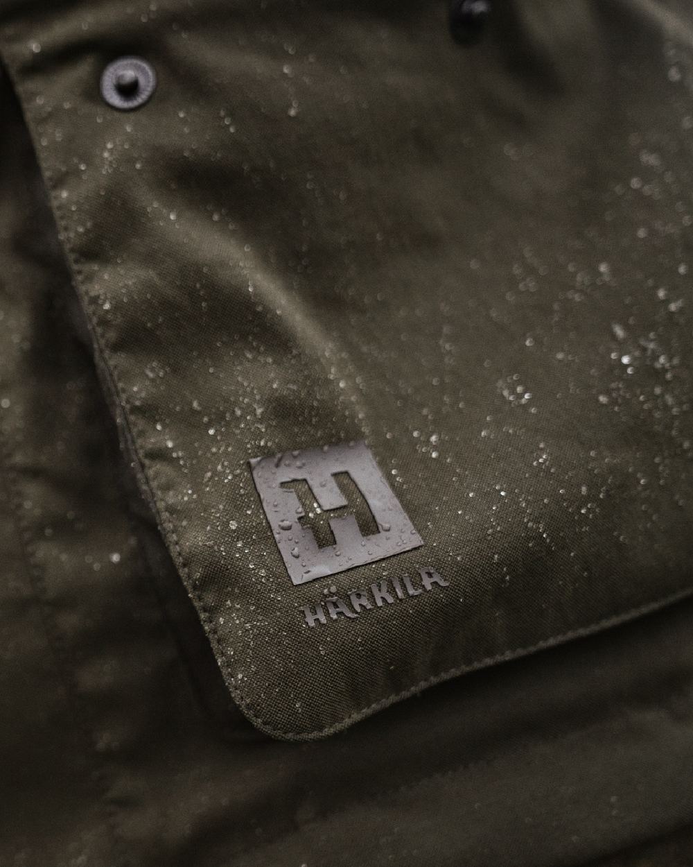 Willow Green Coloured Harkila Pro Hunter Shooting GTX Jacket on outdoor background #colour_willow-green