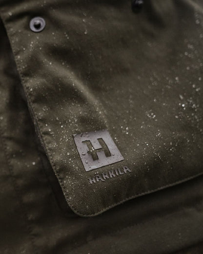 Willow Green Coloured Harkila Pro Hunter Shooting GTX Jacket on outdoor background #colour_willow-green