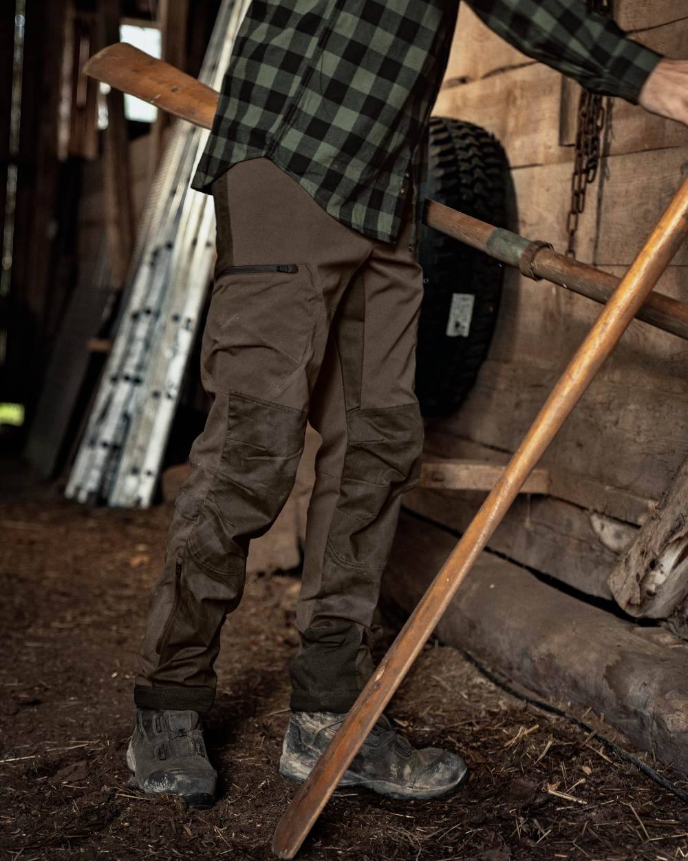 Slate Brown Willow Green Coloured Harkila Ragnar Trousers on outdoor background #colour_slate-brown-willow-green
