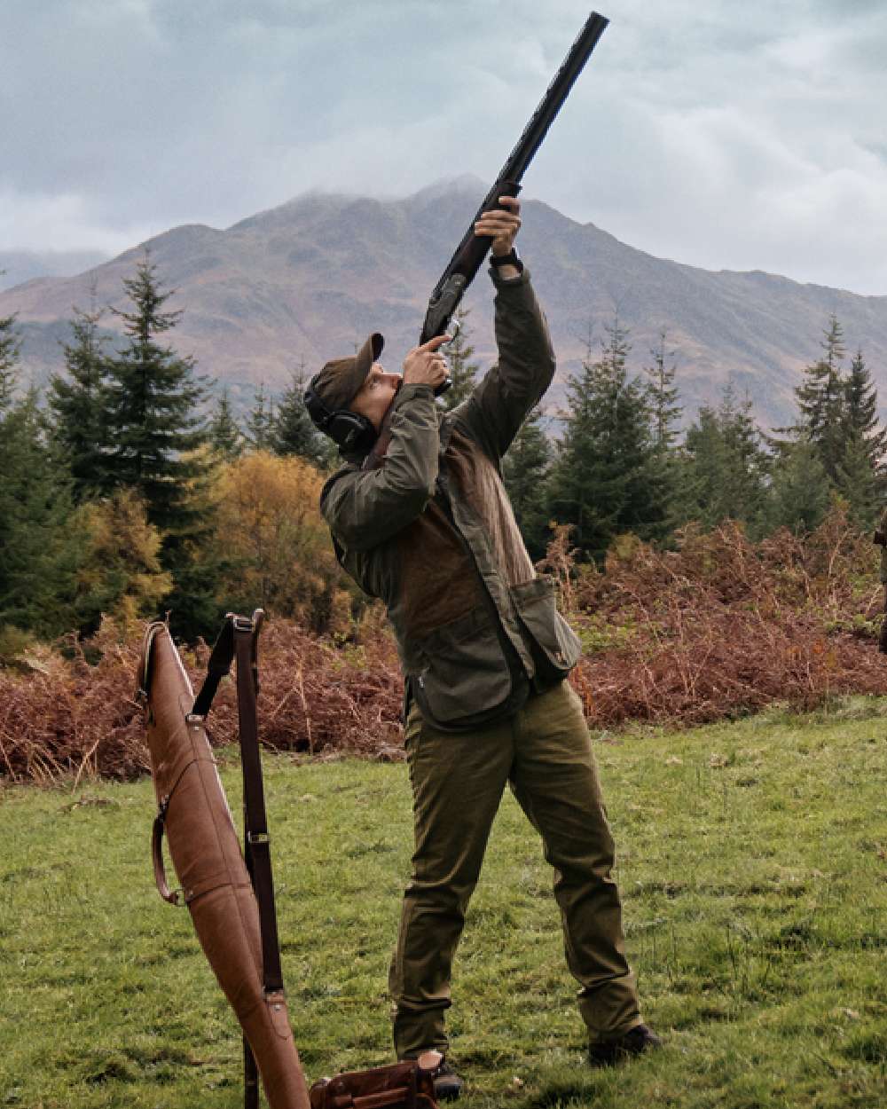 Willow Green Coloured Harkila Rannoch HWS Shooting Jacket on forest background #colour_willow-green