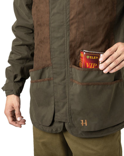 Willow Green Coloured Harkila Rannoch HWS Shooting Jacket on white background #colour_willow-green