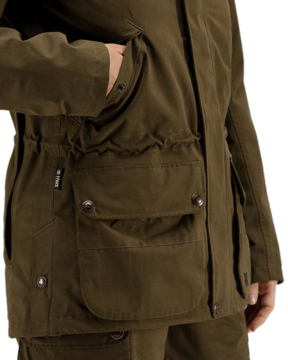Warm Olive Coloured Harkila Retrieve Lady Jacket on white background #colour_warm-olive