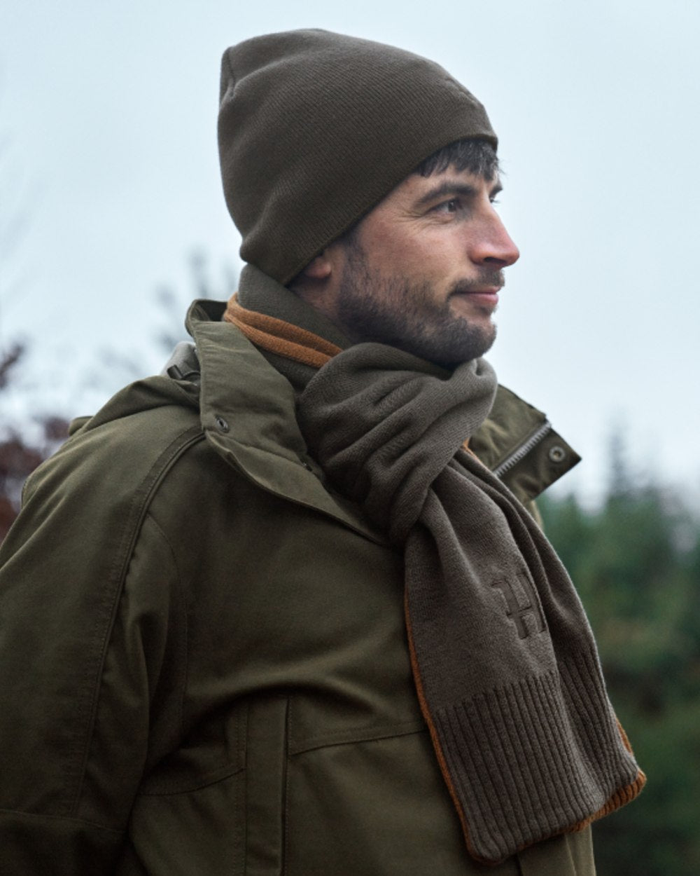 Shadow Brown Rustique Clay Coloured Harkila Reversible Beanie on outdoor background #colour_shadow-brown-rustique-clay