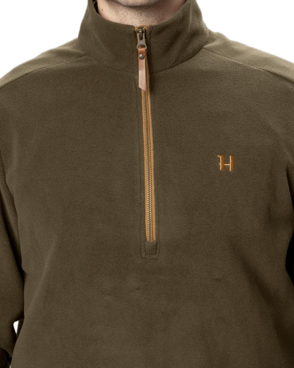 Willow Green Coloured Harkila Sandhem 200 Fleece Pullover on white background #colour_willow-green