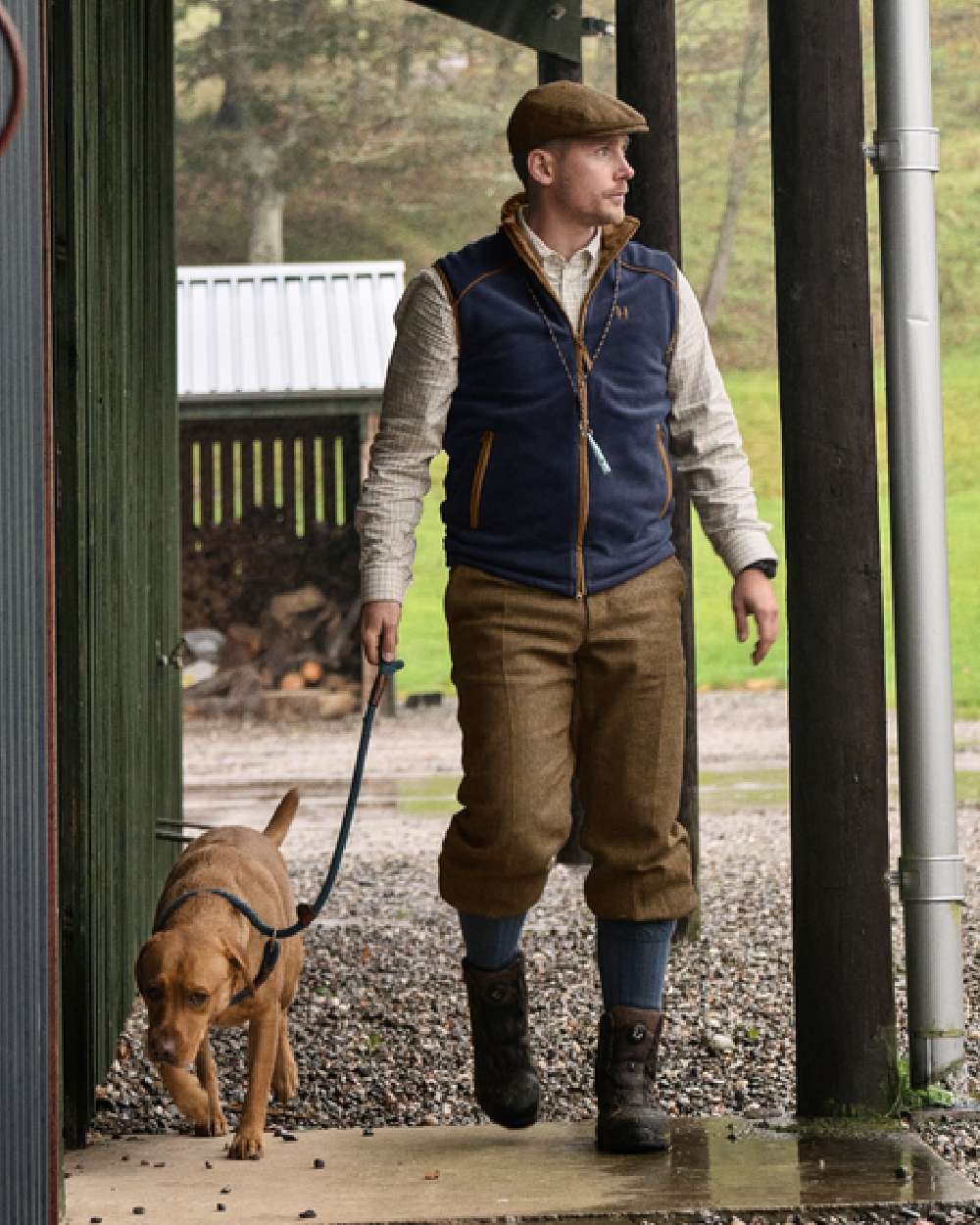 Blue Coloured Harkila Sandhem 200 Fleece Waistcoat on outdoor background #colour_blue