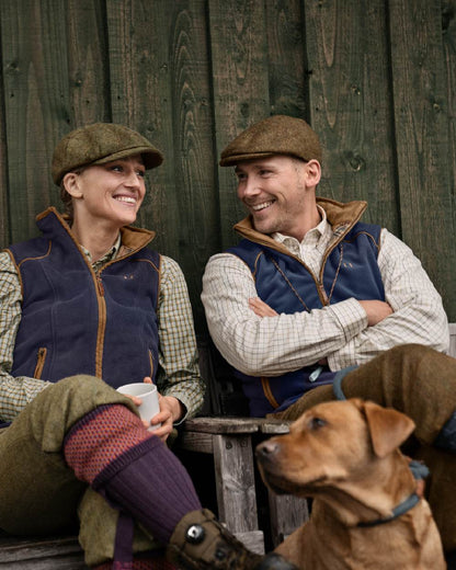 Blue Coloured Harkila Sandhem 200 Fleece Waistcoat on outdoor background #colour_blue