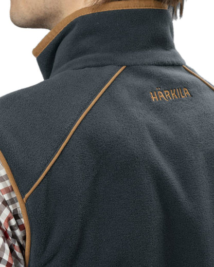 Dark Navy Coloured Harkila Sandhem 200 Fleece Waistcoat on white background #colour_dark-navy