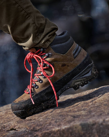 Willow Green Coloured Harkila Saxnas Womens GTX Boots on blurry background #colour_willow-green