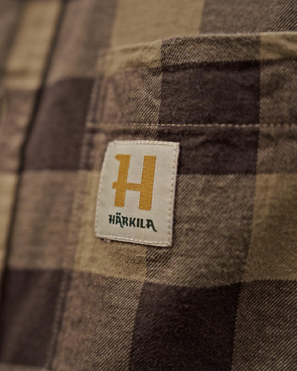 Antique Bronze Check Coloured Harkila Scandinavian Long Sleeve Shirt on blurry background #colour_antique-bronze-check