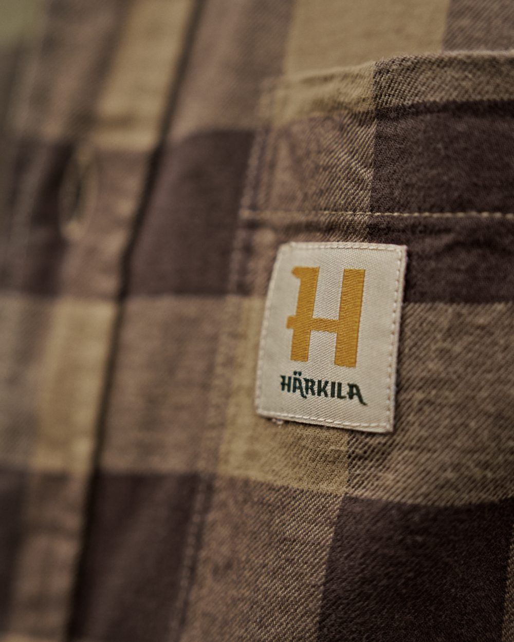 Antique Bronze Check coloured Harkila Scandinavian Long Sleeve Shirt on outdoor background #colour_antique-bronze-check