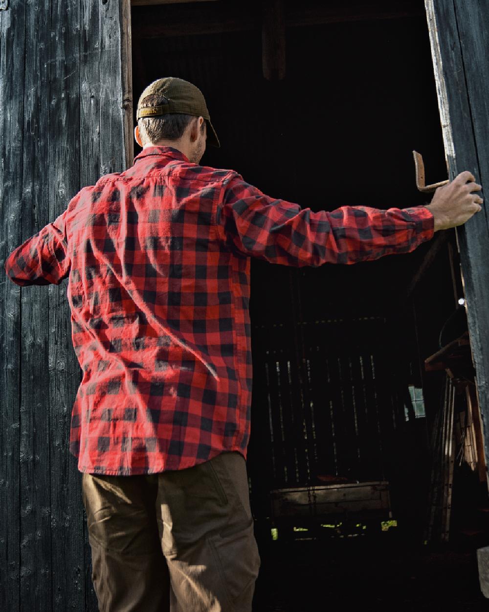Red Check Coloured Harkila Scandinavian Long Sleeve Shirt on outdoor background #colour_red-check