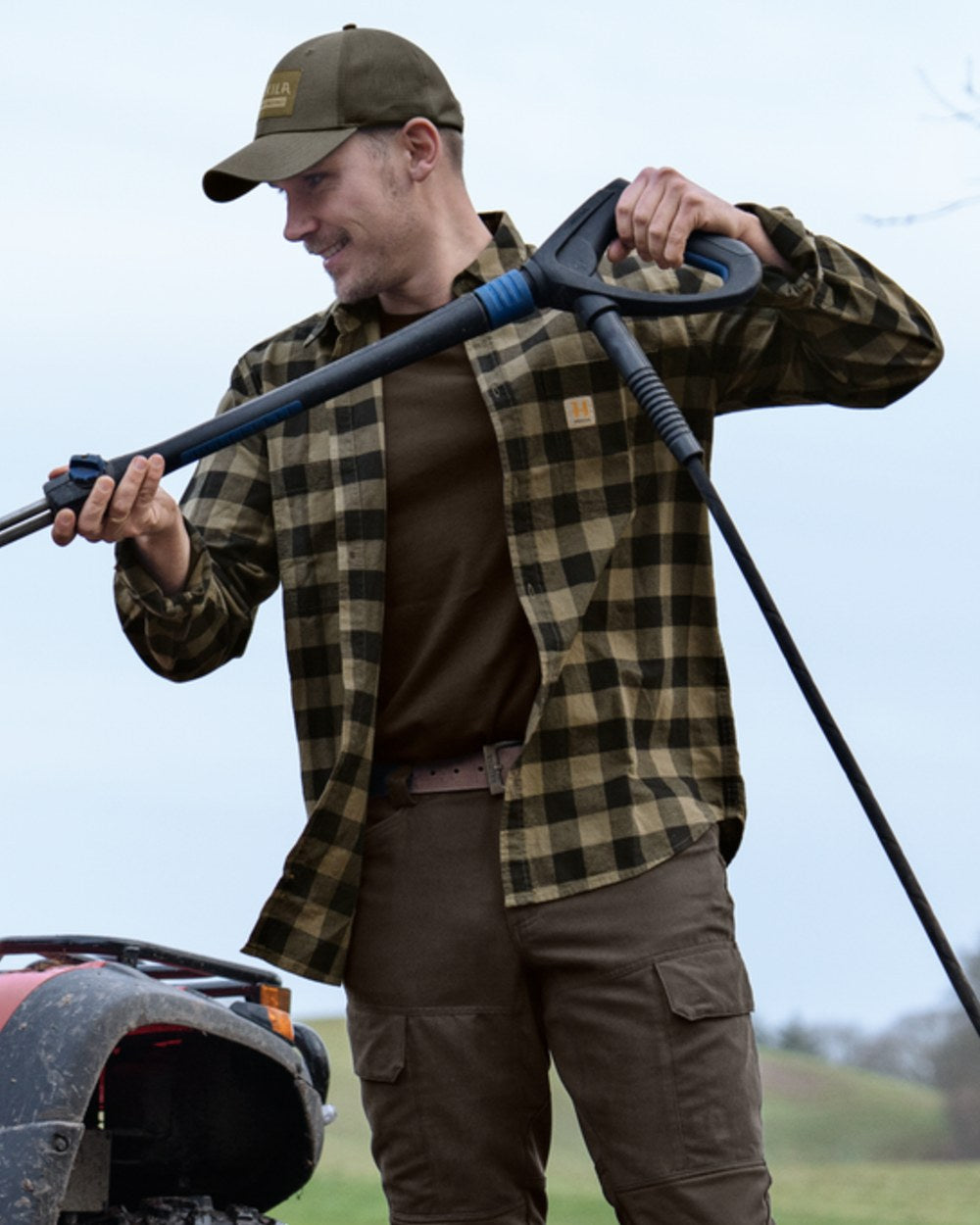 Tarmac Check coloured Harkila Scandinavian Long Sleeve Shirt on outdoor background #colour_tarmac-check