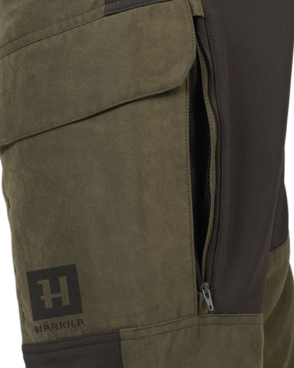 Willow Green Deep Brown Coloured Harkila Scandinavian Trousers on white background #colour_willow-green-deep-brown